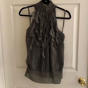 Black and white sleeveless blouse